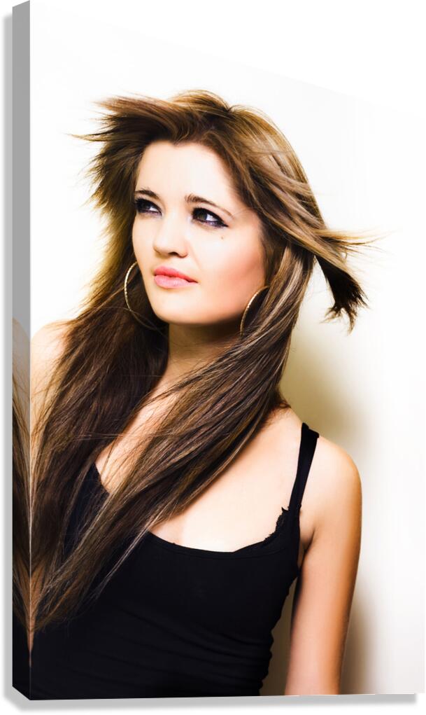 Female fashion model with wind blown hair Canvas Print