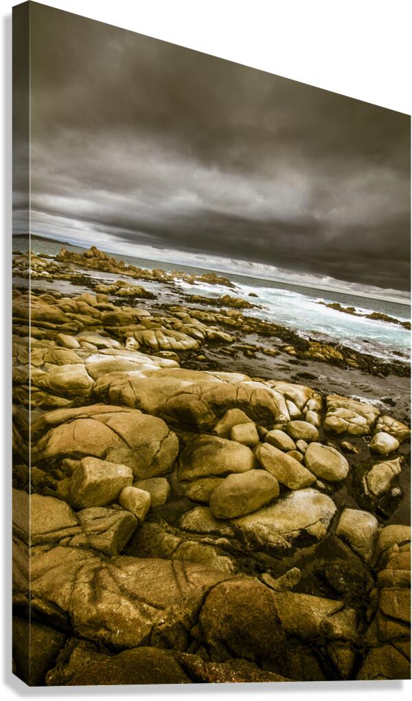 Dark skies on ocean shores Canvas Print