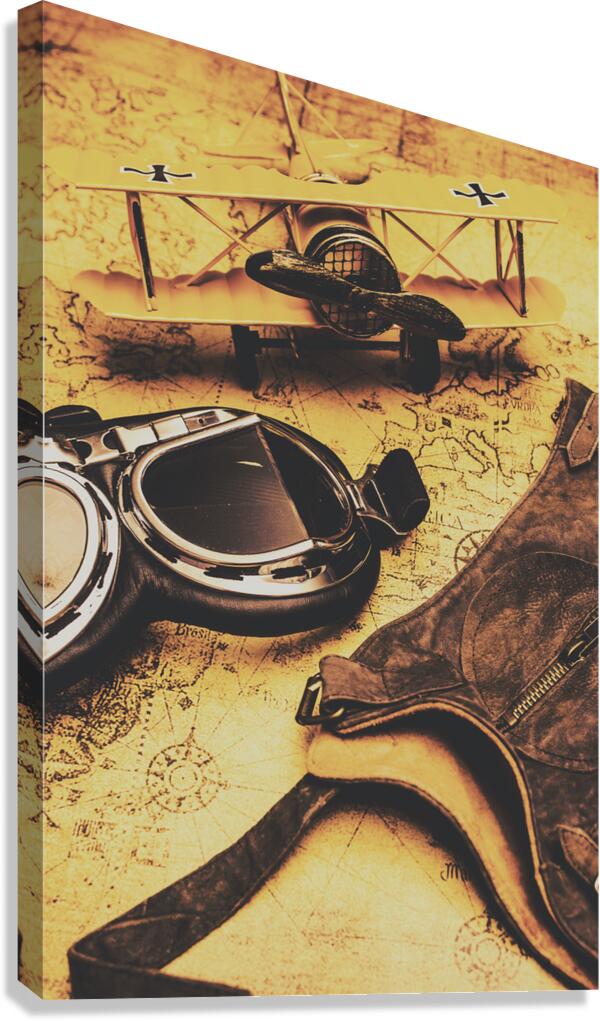Aviator goggles cap and airplane on old world map Canvas Print