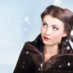 Beautiful brunette woman freezing in outdoor forest