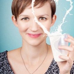 Female nutritionist showing full cream milk love