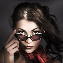 Beautiful pinup woman. Dark 50s fashion portrait