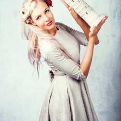 Elegant European Woman Holding Holiday Landmark