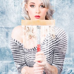 Window cleaner washing shop window. Clearance 