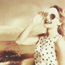 Happy nostalgic pinup traveller at Redcliffe beach