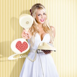 American Girl In Pinup Fashion With Retro Phone