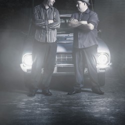 2 male gangsters meeting in dark alleyway