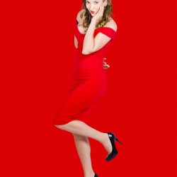 Stunning pinup girl in red rockabilly fashion