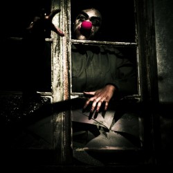 Scary Clown Clawing Window