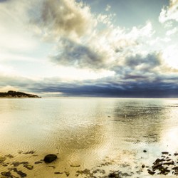 Beach panorama of a sunrise over the sea