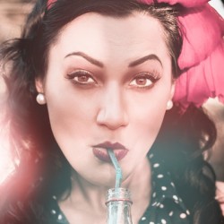 50s pin up girl drinking soda at roadside drive-in