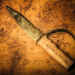 Pirate sword on buried treasure map