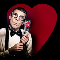 Romantic Nerd Holding Rose On Love Heart Background