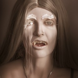 Vintage halloween portrait. Gothic vampire girl