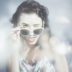 Classy sixties fashion girl in foggy field