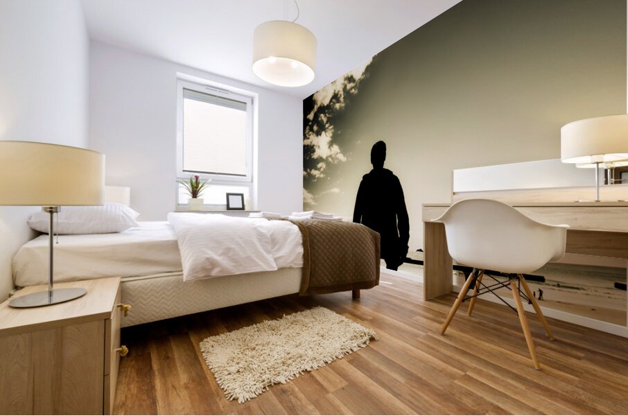 Young Man In Silhouette Sitting In The Sun Mural print