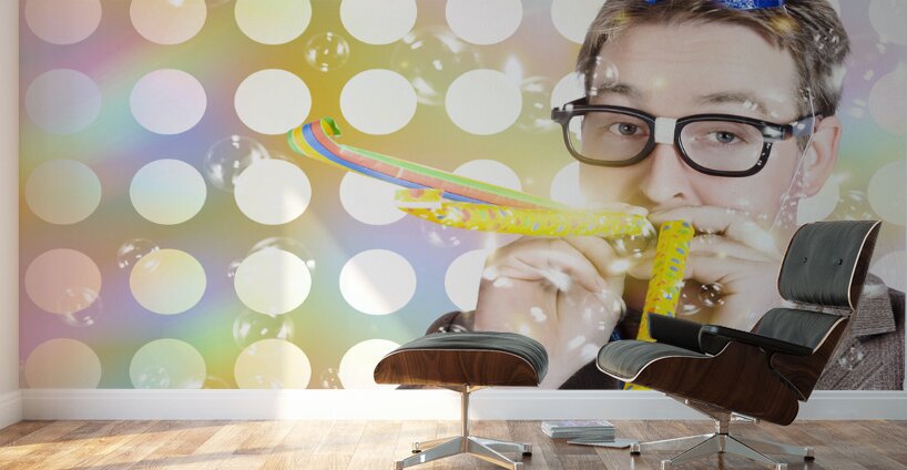 Amusement man in party hat celebrating a birthday bash Wall Murals