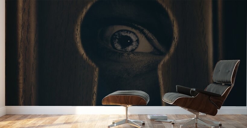 Eye looking through door keyhole Wall Murals