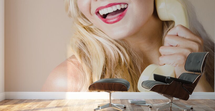 Gorgeous blond woman laughing on telephone call Wall Murals