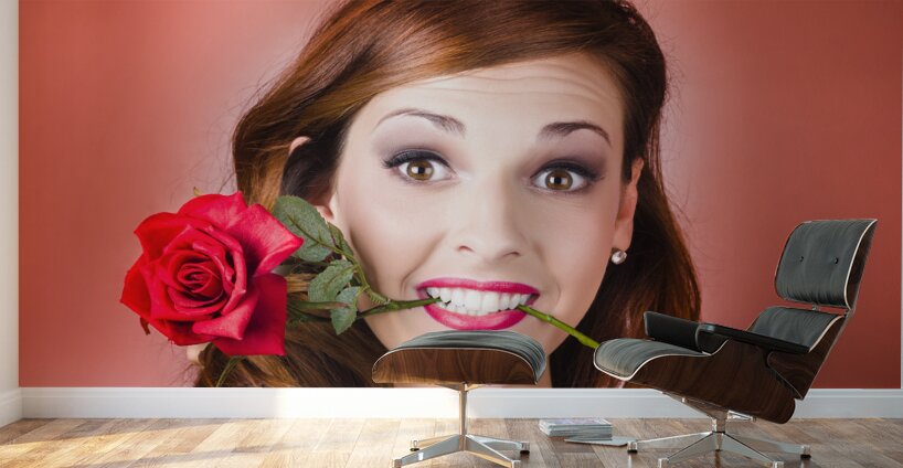 Woman gripping red rose between her teeth Wall Murals