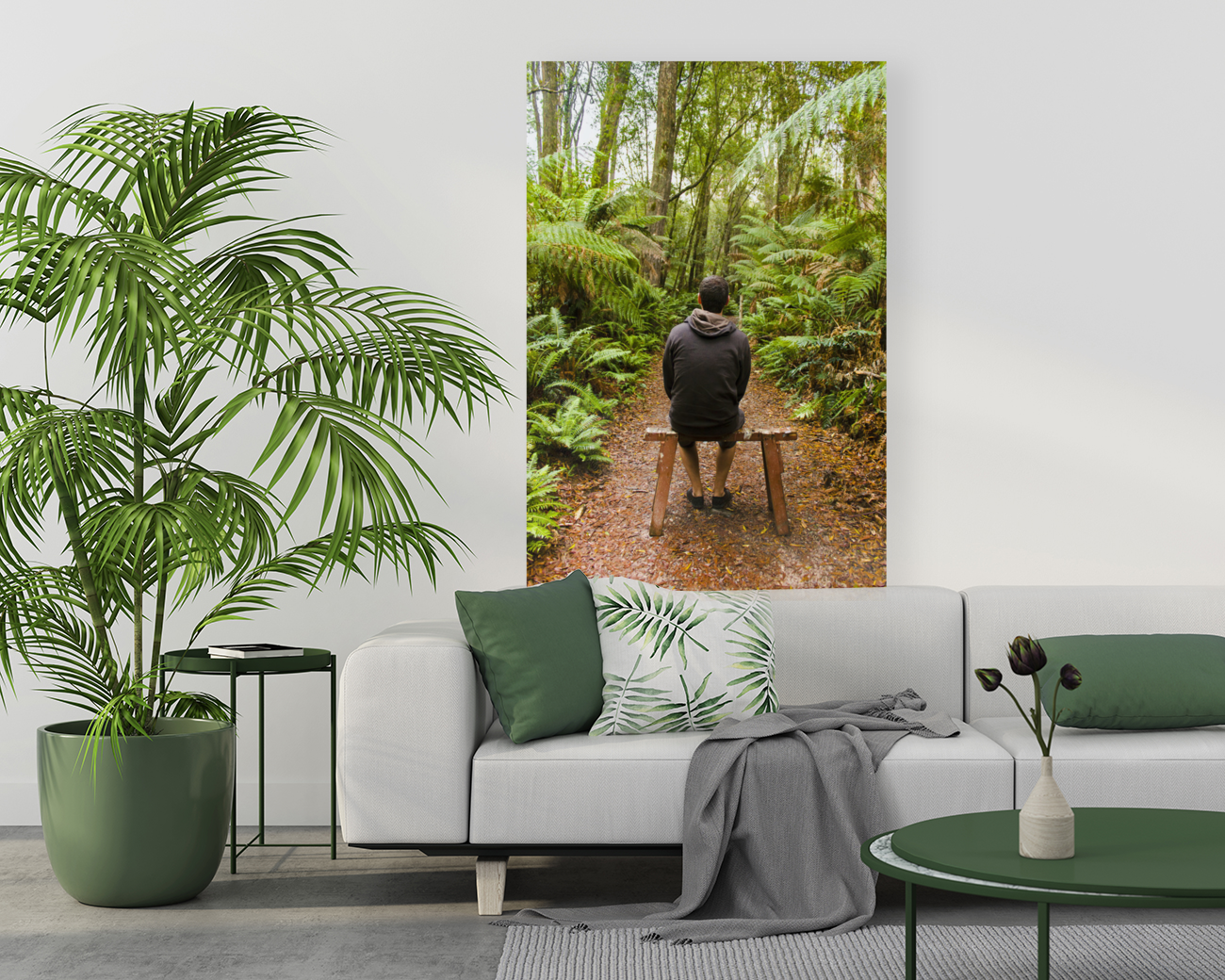 Travel man sitting in a green lush fern forest Art